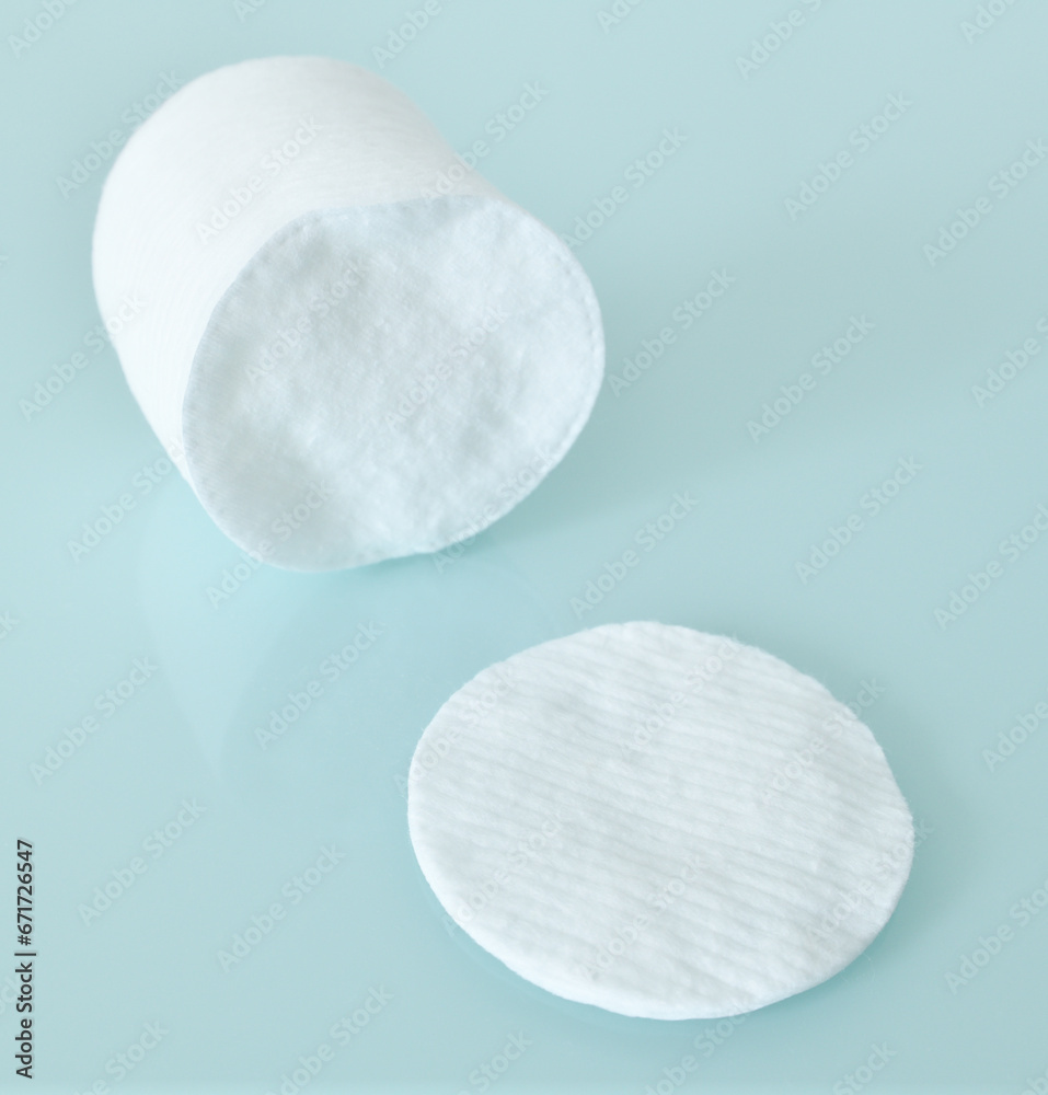Stack of Cotton disks on light blue background Stack of Cotton disks on light blue background
