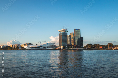 Main tourist centre in Amsterdam, the Netherlands, a view of the whole city on the other side of the canal during sunset