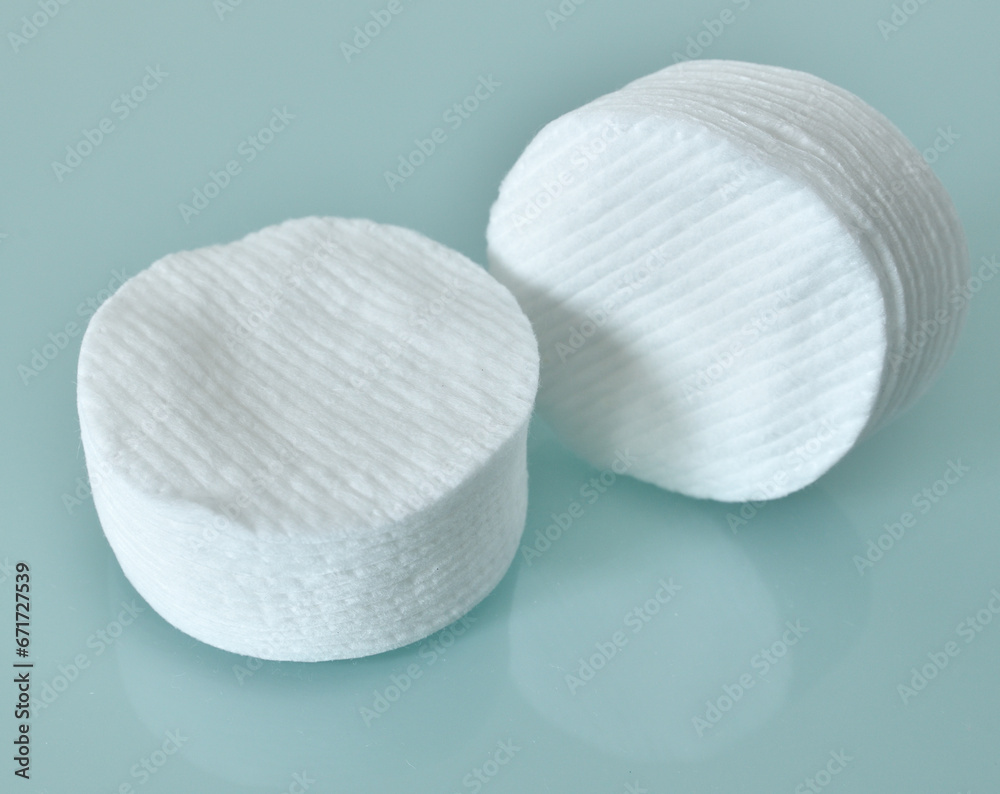 Stack of Cotton disks on light blue background Stack of Cotton disks on light blue background