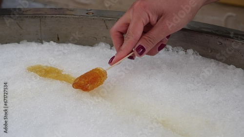 Female With Nail Varnish Rolling Maple Taffy