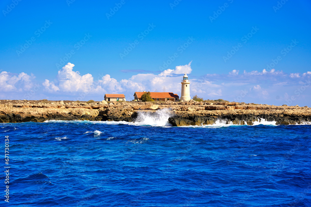 View from the sea towards the lighthouse on the island. View from the sea towards the lighthouse on the island.