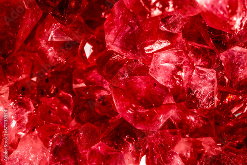 Amethyst red crystals. Gems. Mineral crystals in the natural environment. Texture of precious and semiprecious stones. Seamless background with copy space colored shiny surface of precious stones.