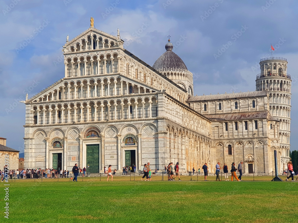 The Cathedral of Santa Maria Assunta and Leaning Tower of Pisa against the blue sky.