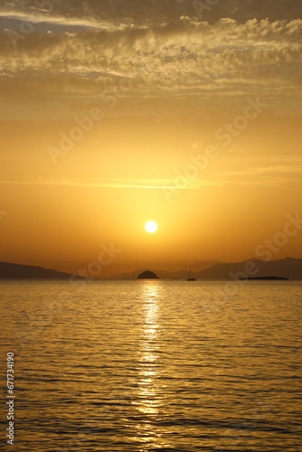 sunset on the beach. Seaside town of Turgutreis and spectacular sunsets. Selective Focus.