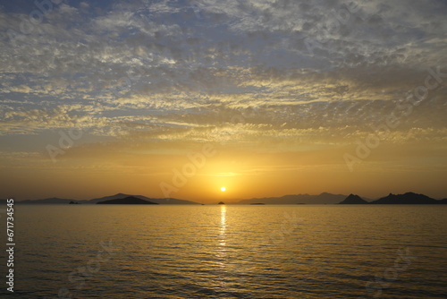 sunset on the beach. Seaside town of Turgutreis and spectacular sunsets. Selective Focus.