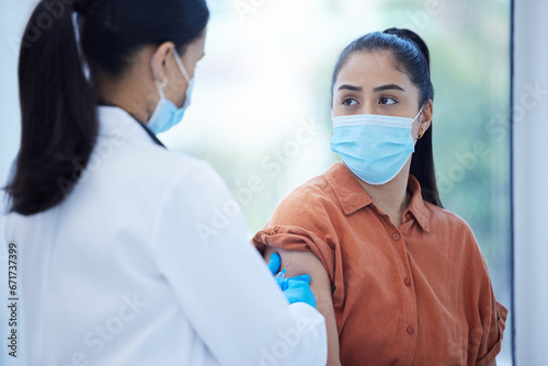 Doctor, covid vaccine or consulting woman for health, wellness or medical healthcare virus safety in hospital. Nurse, help or employee for covid 19 compliance, medicine or dengue injection in clinic photo