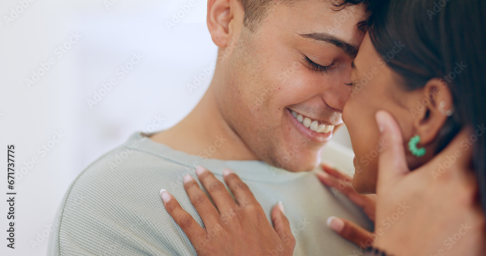 Fototapeta premium Face, love and smile with a couple closeup in their apartment together for care, romance or bonding. Relax, support or touching moment with a happy young man and woman in their home on the weekend