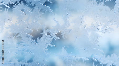 Delicate frost patterns on a clear window © Matthias