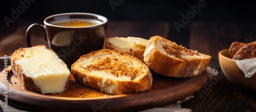 Selective focus on gorgeous cheese breads on rustic wood and a cup of hot coffee