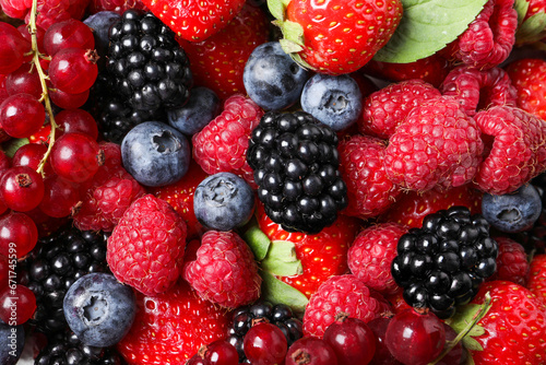 Different fresh ripe berries as background, top view