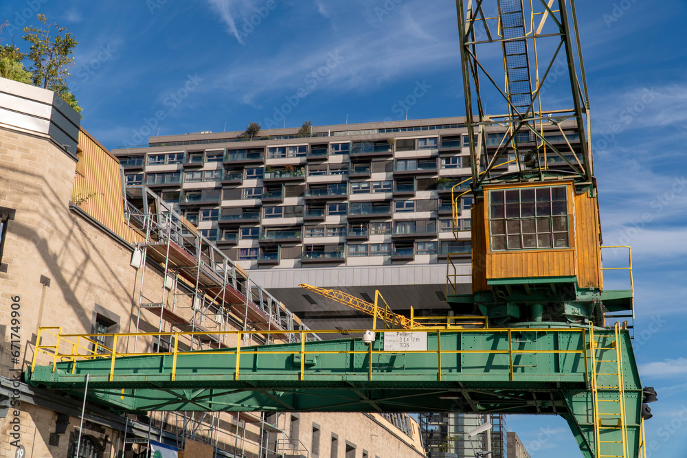 Fototapeta premium Cargo crane near the Kranhaus business center on a sunny morning