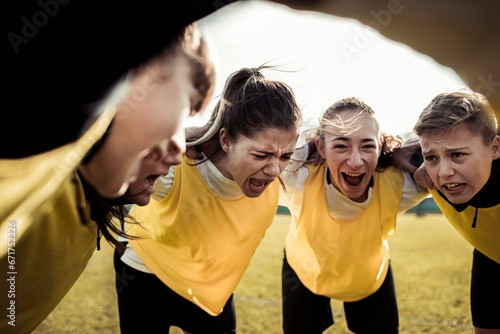 Female soccer team displaying intense emotions during a game photo
