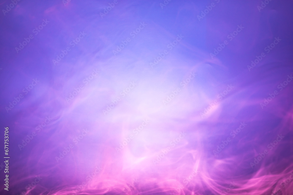 Blurred pink and purple smoke on light blue background. Soft smoke texture