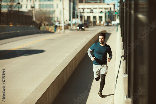 Young man jogging in the city