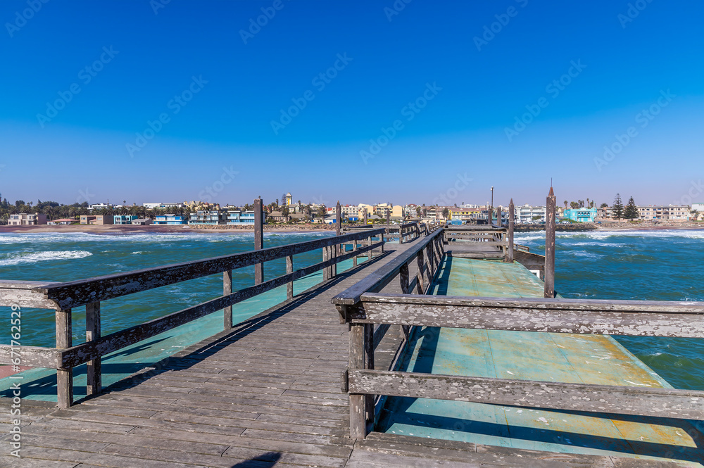 A view across the end of the pier towards the shore at Swakopmund, Namibia during the dry season