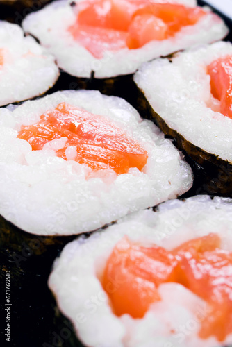Rolls with salmon in a container close up