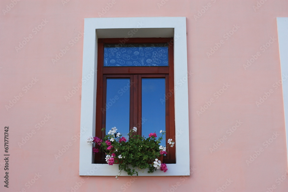 Restored window on the facade of an antique building, Szentendre, Hungary