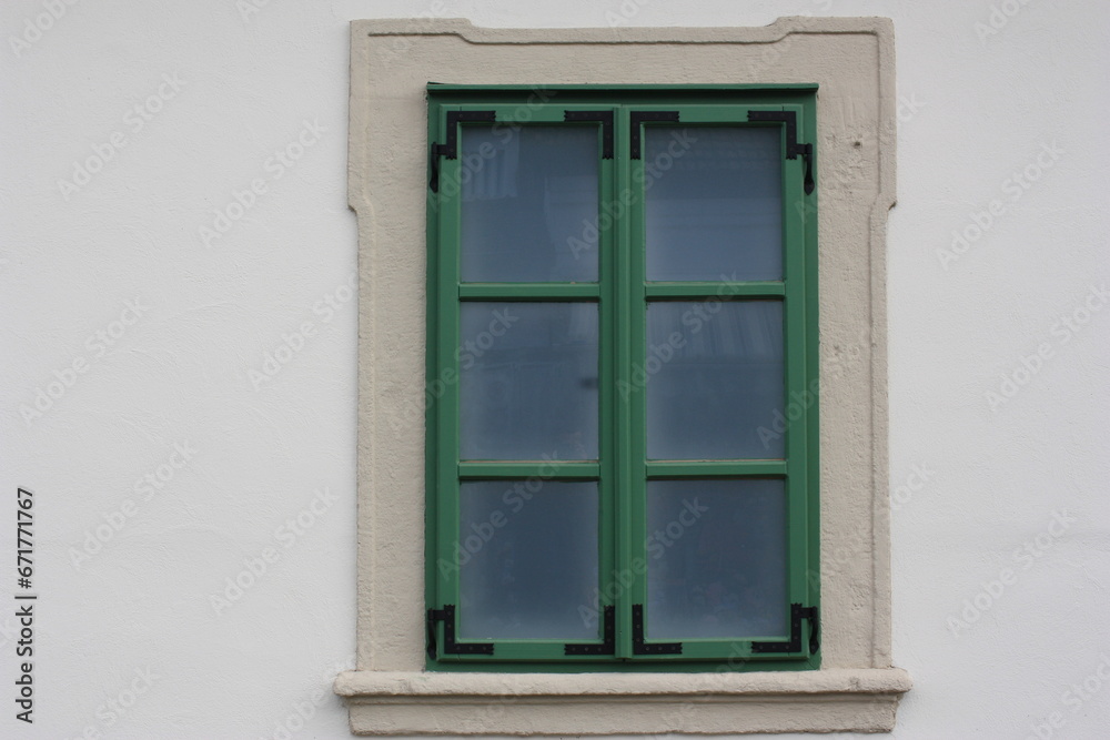 Restored window on the facade of an antique building, Szentendre, Hungary