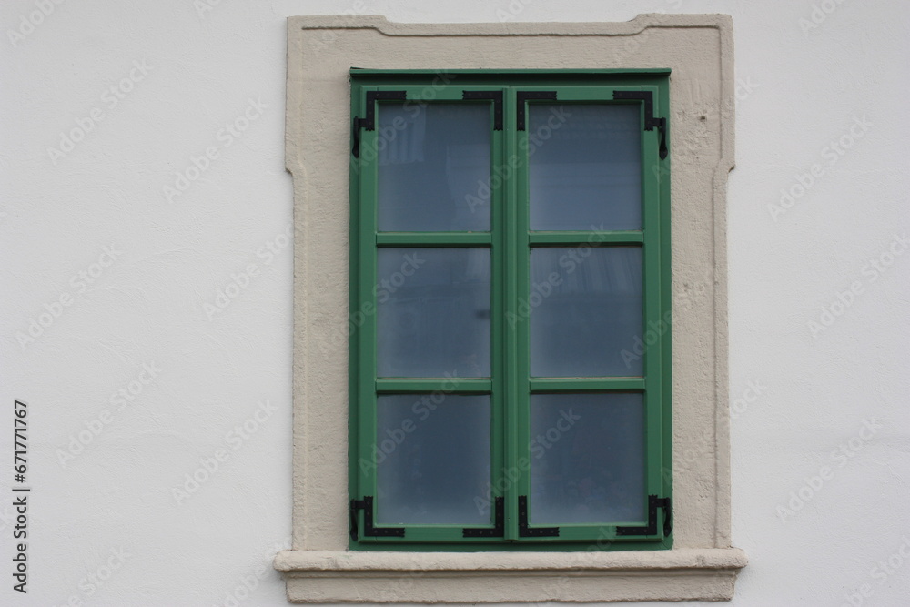 Restored window on the facade of an antique building, Szentendre, Hungary Restored window on the facade of an antique building, Szentendre, Hungary