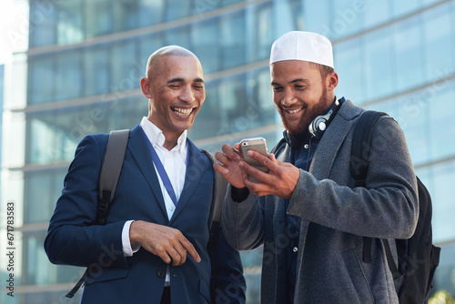 Phone, city and diversity business men for global networking, social media update and corporate collaboration. Happy black man with Arab, muslim or islamic partner on smartphone of international chat photo