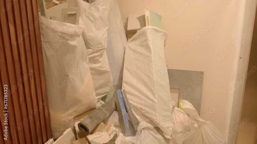 Construction materials and debris during building and renovation. Proper waste disposal and recycling practices are key to minimizing environmental impact. Finishing work inside. Construction materials and debris during building and renovation. Proper waste disposal and recycling practices are key to minimizing environmental impact. Finishing work inside.