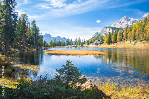Idyllic view of the calm waters of Lake Antorno in the Dolomite Mountains of Italy on a sunny day in October photo