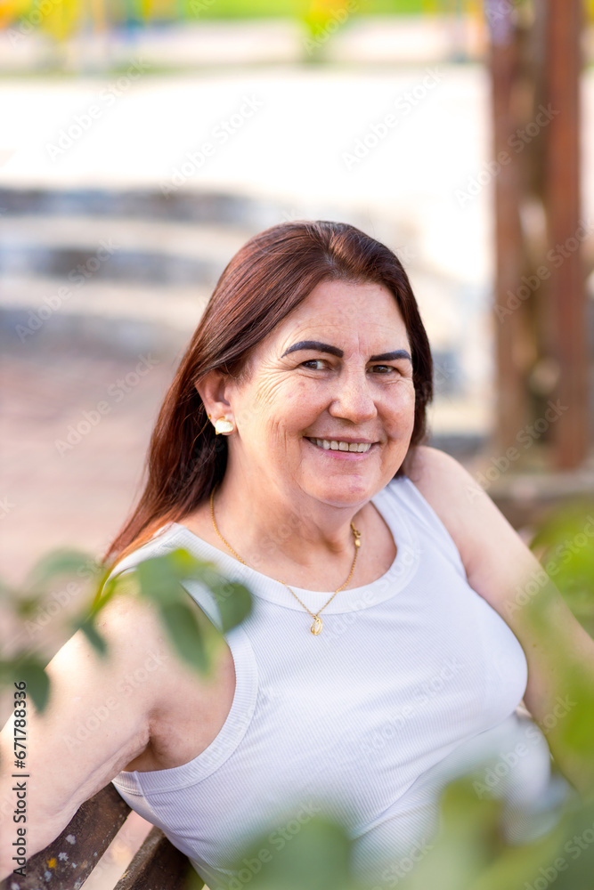 Portrait of a Brazilian mature woman feeling good and happy smiling at camera Portrait of a Brazilian mature woman feeling good and happy smiling at camera
