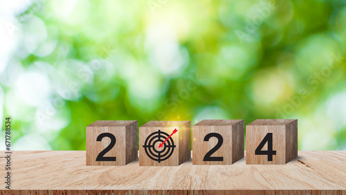 2024 goals of business or life, Wooden cubes with 2024 and goal icon on smart background, Starting to new year, Business common goals for planning new project, annual plan, business target achievement photo