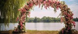 Adorning the outdoor wedding arch with flowers and fabric