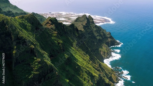 Green mountain range on ocean coastline near Punta del Hidalgo town. Anaga rural park in Tenerife, Canary Islands.