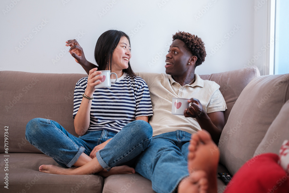 Young couple of different origins sharing good times. Concept: lifestyle, bond, connection Young couple of different origins sharing good times. Concept: lifestyle, bond, connection