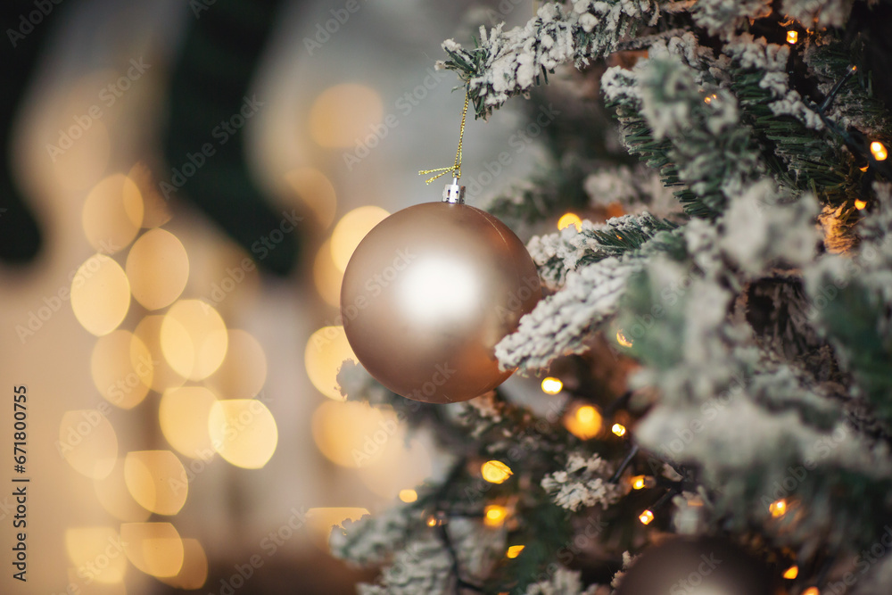 Christmas decorations, background blur. Christmas decorations on the holiday tree. Many balls garland glowing lamps on the branches. Christmas and New Year ornament. Christmas beautiful lights bokeh. Christmas decorations, background blur. Christmas decorations on the holiday tree. Many balls garland glowing lamps on the branches. Christmas and New Year ornament. Christmas beautiful lights bokeh.