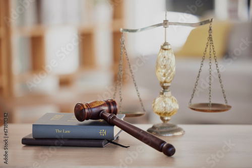 Background, gavel and law books with scales on table of judge, attorney and court trial. Closeup of legal hammer, notebook or desk of lawyer in constitution, equality and human rights of fair justice photo