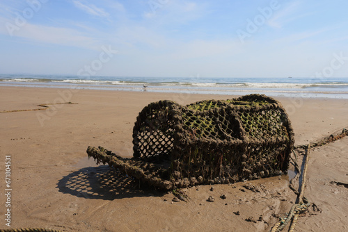 Old lobster pot washed on a beach