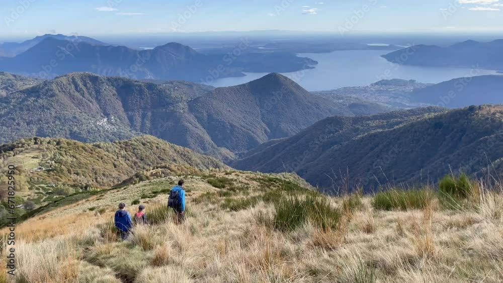 Father and his sons hiking in Val Grande, national park close to Lago Maggiore, Italy, Father and his sons hiking in Val Grande, national park close to Lago Maggiore, Italy,