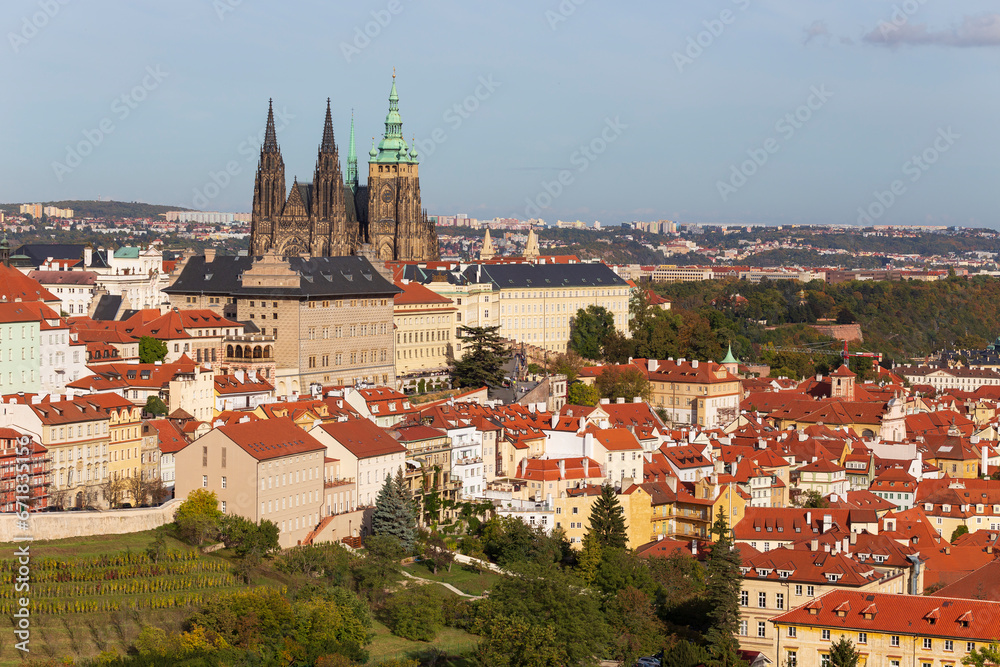 Autumn Prague City with gothic Castle, colorful Nature and Trees with blue Sky from the Hill Petrin, Czech Republic