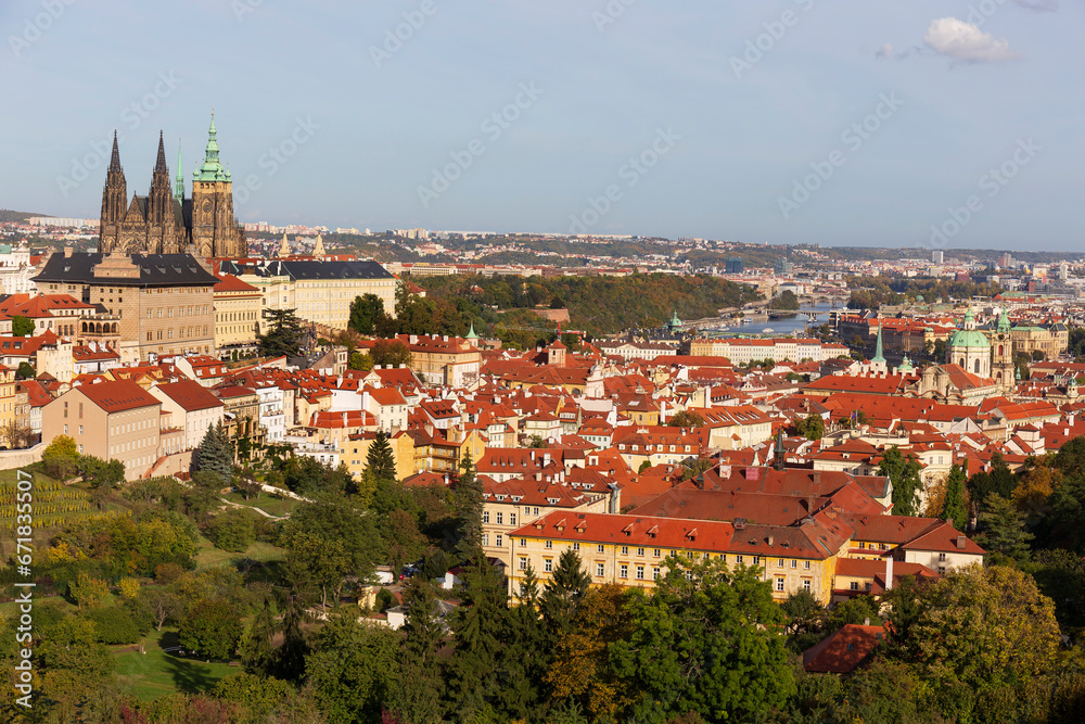 Autumn Prague City with gothic Castle, colorful Nature and Trees with blue Sky from the Hill Petrin, Czech Republic