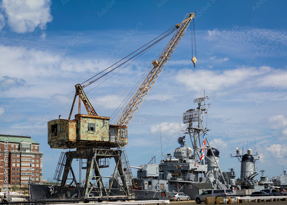 Portal crane with the background of USS Cassin Young at Charlestown Navy Yard dry dock, Boston, MA, USA Portal crane with the background of USS Cassin Young at Charlestown Navy Yard dry dock, Boston, MA, USA