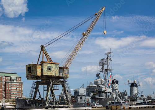 Portal crane with the background of USS Cassin Young at Charlestown Navy Yard dry dock, Boston, MA, USA