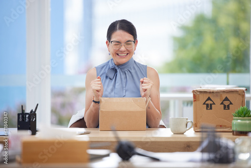 Excited, delivery and box of business woman in office happy with product from courier service, ecommerce and supply chain industry. Success, logistics and employee with cardboard package for unboxing photo