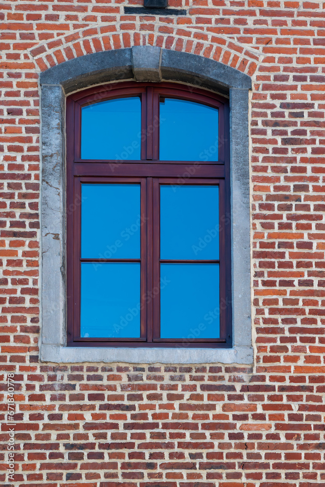 window on the brick wall,A window against a brick wall