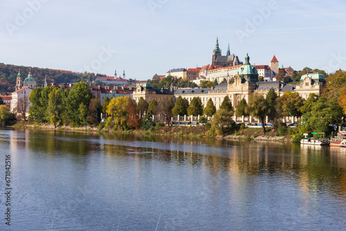 Autumn colorful Prague Lesser Town with gothic Castle above River Vltava in the sunny Day, Czech Republic © Kajano
