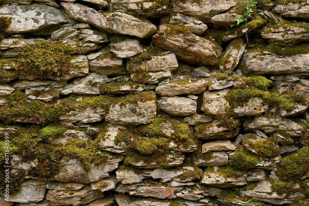 Moldy rustic stone wall