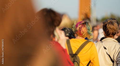 the girl with lots of multicolored hair. diversity.
