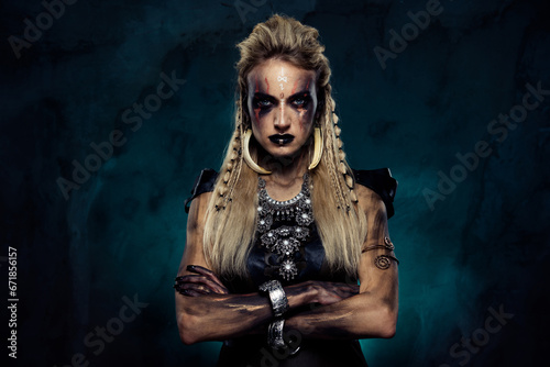 Tablou pe pânză Photo of powerful tribal queen princess crossing arms fighting in north viking w
