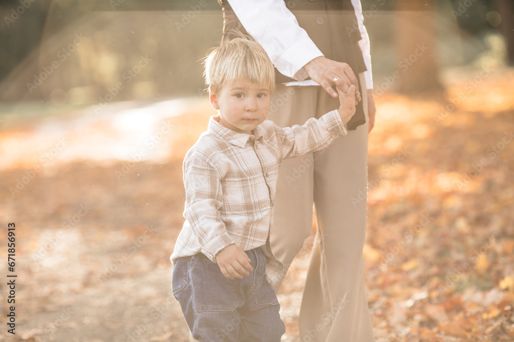 Mothers day, love family. Family on autumn walk in nature outdoors. Mother and child with hugging tenderness Mothers day, love family. Family on autumn walk in nature outdoors. Mother and child with hugging tenderness