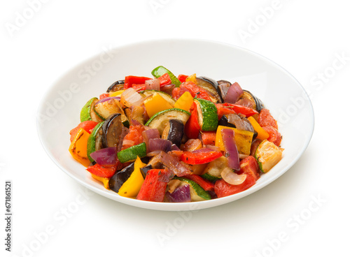 Ratatouille salad in a porcelain salad bowl isolated on white background.