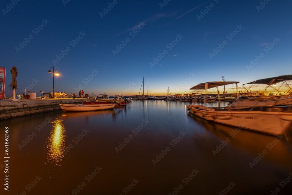 Picture over the harbor of Fazana in Istria in the evening during sunset