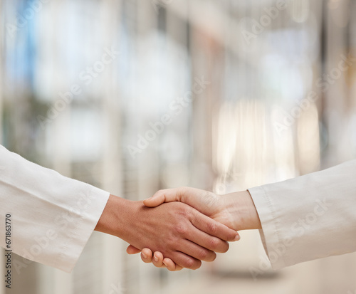 Doctors, partnership and handshake for teamwork, collaboration and agreement. Shaking hands, medical professional and people in cooperation for healthcare, wellness and thank you, welcome and success