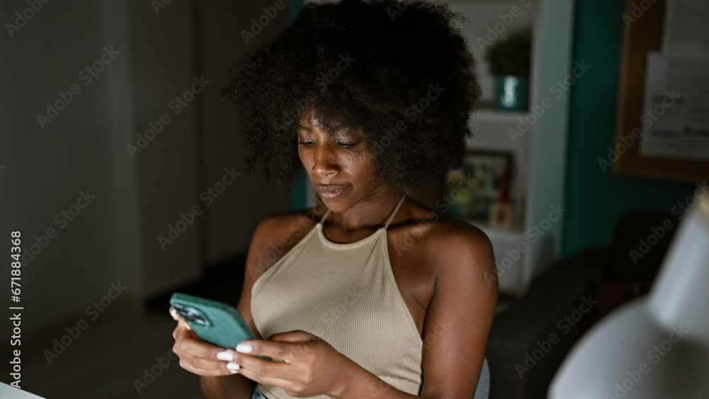 African american woman business worker using smartphone working at the office African american woman business worker using smartphone working at the office
